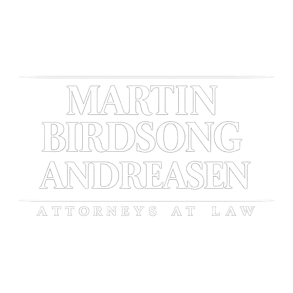 Neon sign logo for a law firm reading 'Martin Birdsong Andreasen' with 'Attorneys at Law' underneath.